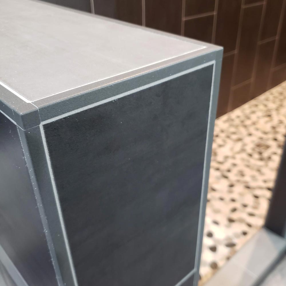 Closeup of tiled ledge separting Bathtub surround from Walk-in Shower Closeup of tiled ledge separting Bathtub surround from Walk-in Shower