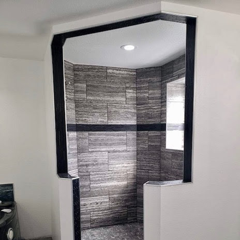 Custom-built octagon-shaped walk-in shower trimmed out in Schluter metal Custom-built octagon-shaped walk-in shower trimmed out in Schluter metal